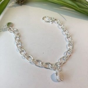 Silver bracelet with seashell charms